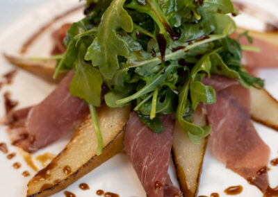 Delicious meat and cheese plate with balsamic drizzle